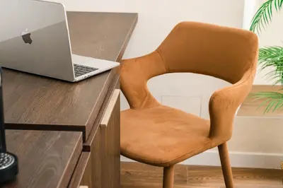 a chair sitting at a desk with a laptop computer at IV Leoni in Rome