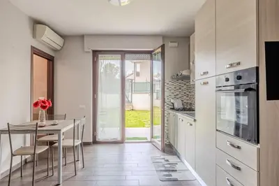 a kitchen with a table and a dining room at Primavera Home in Rome
