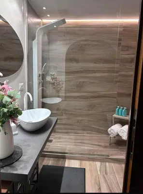 a bathroom with a sink and a shower at Domus Angel's of Rome in Rome