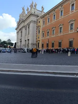 a building with a horse standing in front of a street at Aldo in Rome