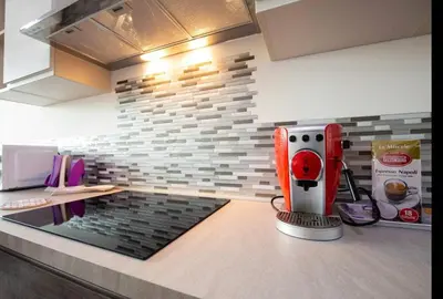 a kitchen with a red mixer on a counter at Stylish suite close by Trastevere and city life in Rome