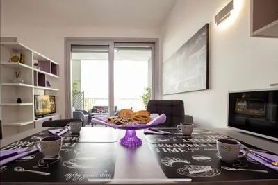 a dining room table with a bowl of food on it at Stylish suite close by Trastevere and city life in Rome