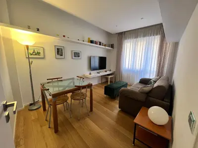 a living room with a couch and a table in a room at San Giovanni tourist accommodation in Rome