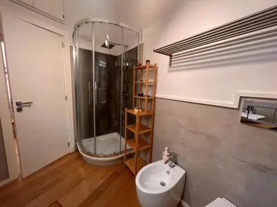 a bathroom with a shower and a toilet and a sink at San Giovanni tourist accommodation in Rome