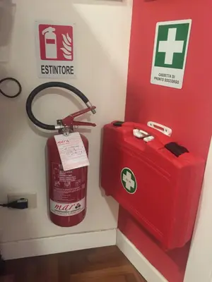 a fire extinguisher and a fire hydrant in a room at B&B Le Vibrazioni in Rome