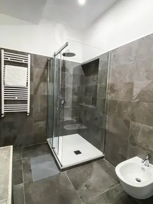 a bathroom with a shower and a sink at Roman Forum Rooms in Rome