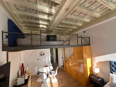 a loft apartment with a bed on the ceiling at Residenza Nobile Vittoria in Rome