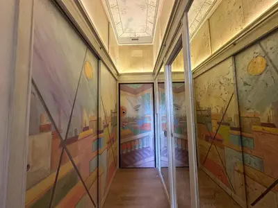 a hallway with colorful paintings on the walls at Residenza Nobile Vittoria in Rome