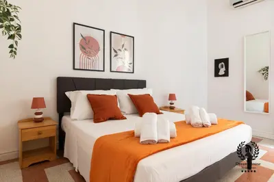 a bedroom with a large bed with towels on it at Dream House Re di Roma - 50mt to Metro Station, central position, 4pax, 2bdr in Rome