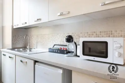 a kitchen counter with a microwave and a mixer at Dream House Re di Roma - 50mt to Metro Station, central position, 4pax, 2bdr in Rome