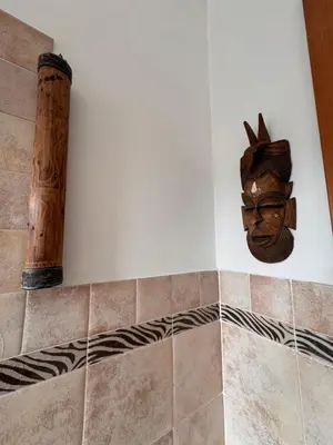 a statue of a head on a wall in a bathroom at Vatican District, Roma, alloggio centrale in Rome