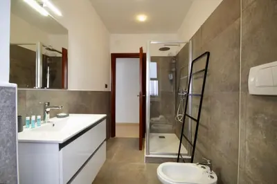 a bathroom with a sink and a shower and a toilet at HC - Baldo degli Ubaldi Elegant Apartment in Rome