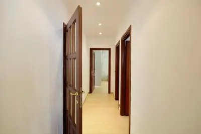 a hallway with two open doors and a hallwayngth at HC - Baldo degli Ubaldi Elegant Apartment in Rome