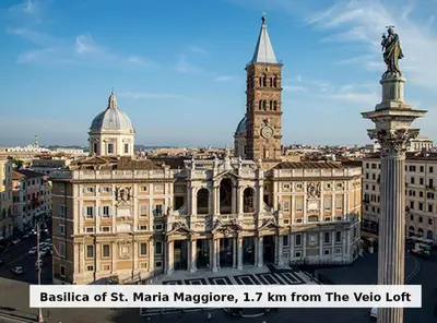 a large building with a clock tower on top of it at Veio Loft in Rome