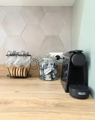 a kitchen counter with a toaster and other appliances at Casa Alice Near Vatican City - Modern, High Floor with View in Rome