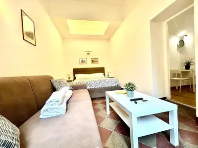 a living room with a couch and a table at Vatican Apartment 2 minuti da città del vaticano in Rome
