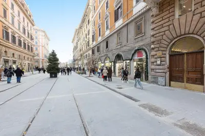a group of people walking down a city street at Vatican Apartment 2 minuti da città del vaticano in Rome