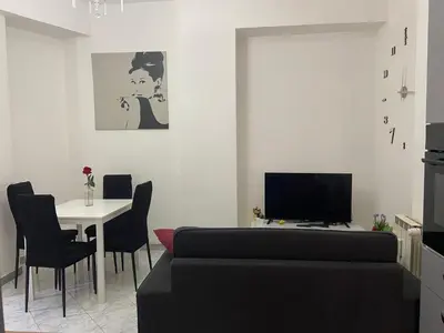 a living room with a couch and a table at Asia Guest House in Rome