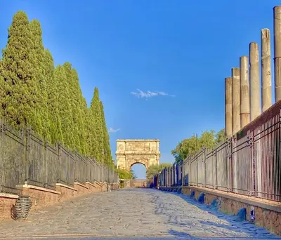 a bridge with the arch in the background at Santa Maria Maggiore Suites Apartments in Rome