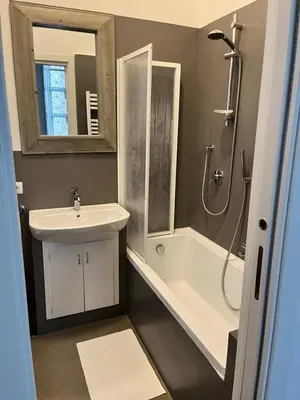a bathroom with a sink and a shower and a toilet at Gianicolo Hill Apartment in Rome