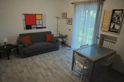 a living room with a couch and a table at Casa Cycas in Rome