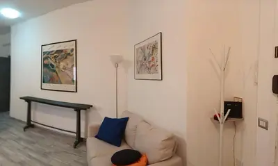 a living room with a couch and a table at Casa Cycas in Rome