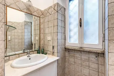 a bathroom with a sink and a window at Residenza Ripetta in Rome