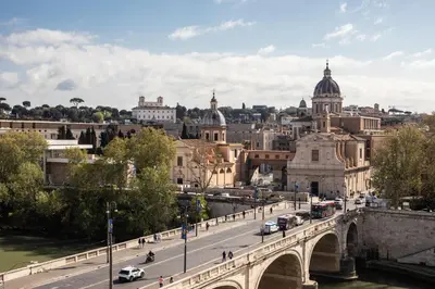 a view of a bridge over a river and a city at iFlat Contemporary Elegant Skyline in Rome in Rome