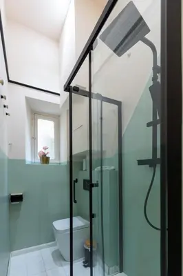 a bathroom with a glass shower with a toilet at The 38 Home Exclusive - Homkeey Apartments in Rome