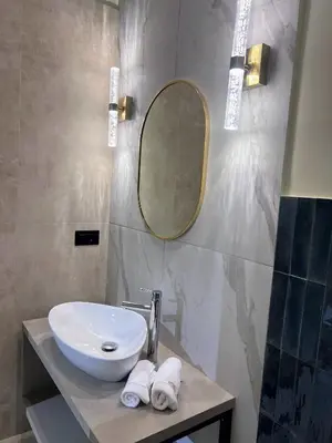 a bathroom with a sink and a mirror at Mia House Prestige in Rome