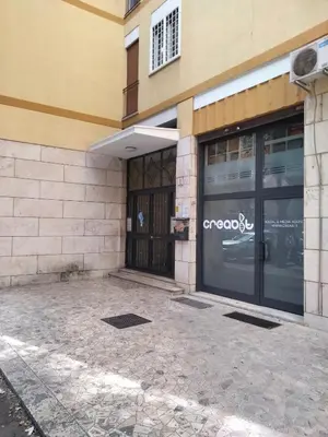 a store front of a building with a glass door at Alloggio turistico Artù in Rome