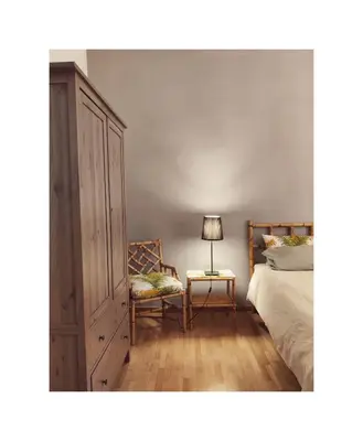 a bedroom with a bed and a cabinet and a lamp at Saint Bon Apartment Good for Families in Rome
