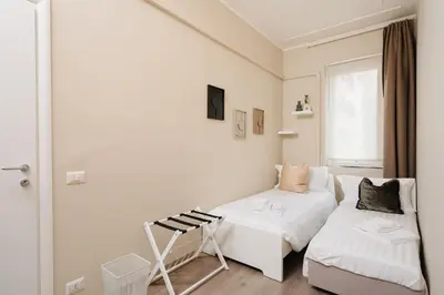 a small room with a bed and a couch at Santamato Vatican Apartment in Rome