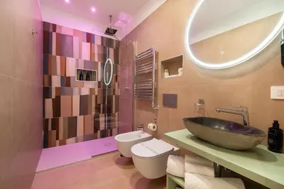 a bathroom with a sink and a toilet and a mirror at 69 Suite Boutique in Rome