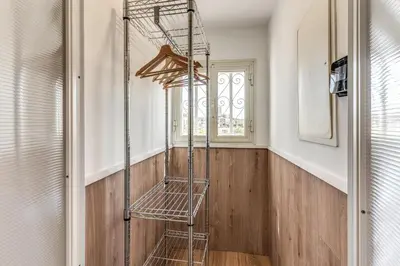 a metal ladder in a room with a window at Attic with terrace Spanish Steps exclusive in Rome