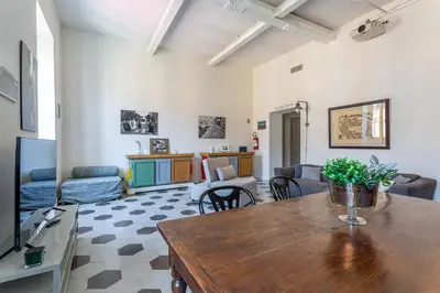 a living room with a table and a couch at iFlat Contemporary Design Living in Rome in Rome