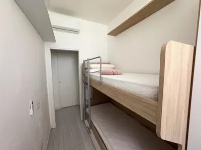 a small room with two bunk beds in it at Valerias Nest Elegant Apt with WiFi and Charm in Rome