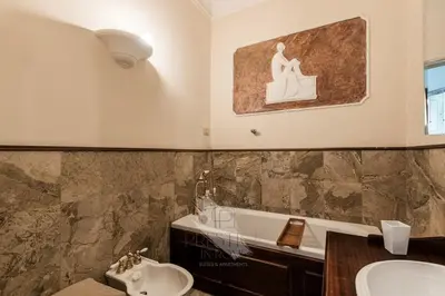 a bathroom with a sink and a toilet and a tub at New! Una Finestra su San Pietro in Rome