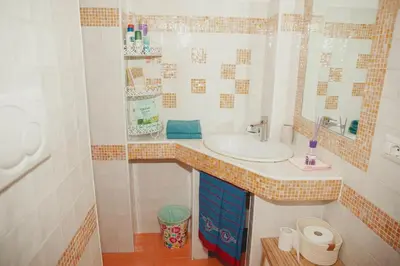a bathroom with a sink and a mirror at La Casetta del '32 in Rome