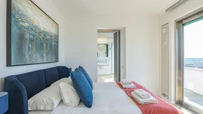 a bedroom with a bed and a large window at EasyTopStay - Rome from above Apt with a view in Rome