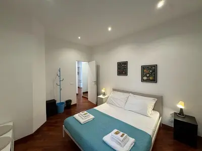a bedroom with a bed with two towels on it at St John Apartment in Rome in Rome