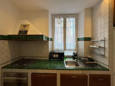 a kitchen with a sink and a counter top at St John Apartment in Rome in Rome