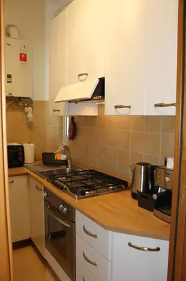 a kitchen with a stove and a counter top at Interno 10 in Rome