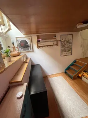 a small room with a bench and a bed at AT Simone Cavallini in Rome