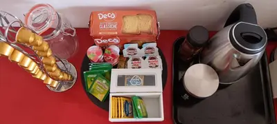 a table with food and other items on it at Pinuz Guest House in Rome