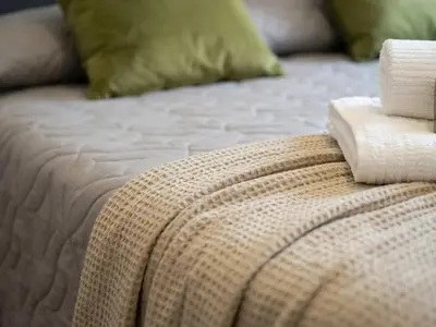 a bedroom with two beds with towels on them at Rome in Style Colosseum in Rome