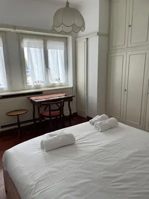 a bedroom with a white bed with two pillows on it at Vatican Vibes - 5 minutes from the Pope in Rome