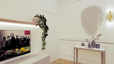 a white room with a mirror and a table at Apartament Leutari in Rome