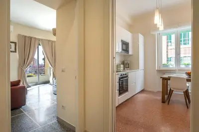a kitchen with a table and a dining room at Baglivi 8 - Sapienza - Metro B in Rome