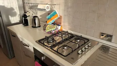 a stove top oven sitting on top of a kitchen counter at The Sunny House of Rome in Rome